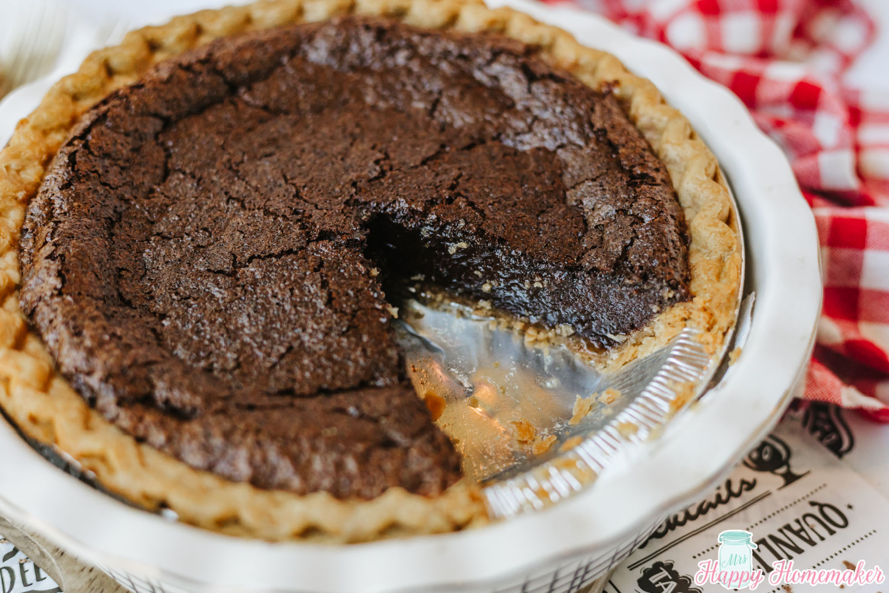 Chocolate Fudge Pie with a slice missing out of the pie
