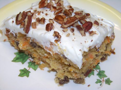 sliced Carrot Cake with pecans on top