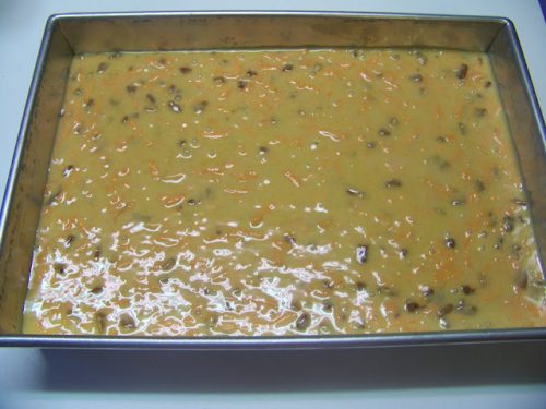 unbaked carrot cake in a cake pan