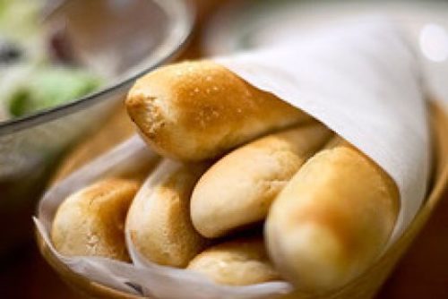 Copycat Olive Garden Breadsticks wrapped up in a napkin