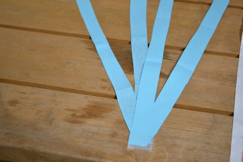 3 strips of blue paper