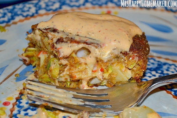 These Zucchini Crab Cakes couldn't get any easier to make or any more delicious to eat. They are a family favorite in my home! Here they are with some chipotle ranch sauce drizzled on top, a personal favorite of mine.