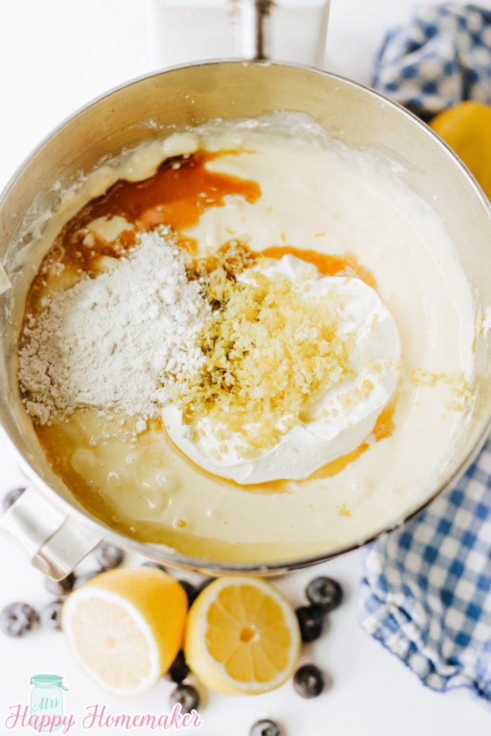 lemon cheesecake batter in a bowl being mixed up