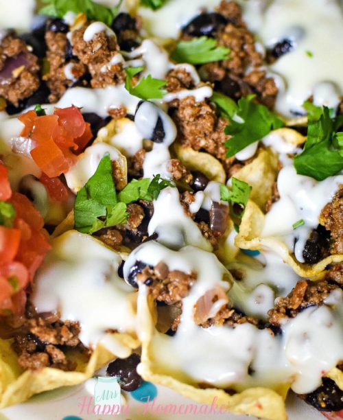 Super Nachos - loaded nachos with ground beef, pico de Gallo and cheese sauce