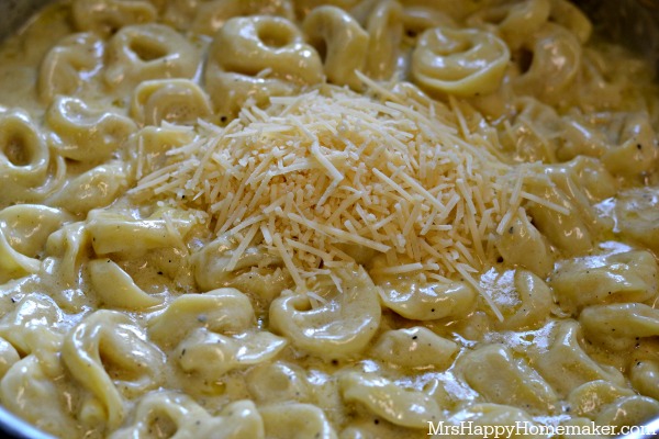 Easy Roasted Garlic Alfredo Tortellini with freshly shredded parmesan on top 