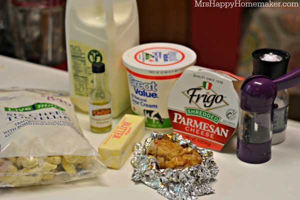 The ingredients on the countertop for Easy Roasted Garlic Alfredo Tortellini
