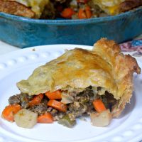 This Beef Puff Pie recipe has been a family favorite for many years now. Beef & veggies simmered in a secret ingredient then encased in a puff pastry crust. ABSOLUTELY DELICIOUS!! | MrsHappyHomemaker.com @MrsHappyHomemaker