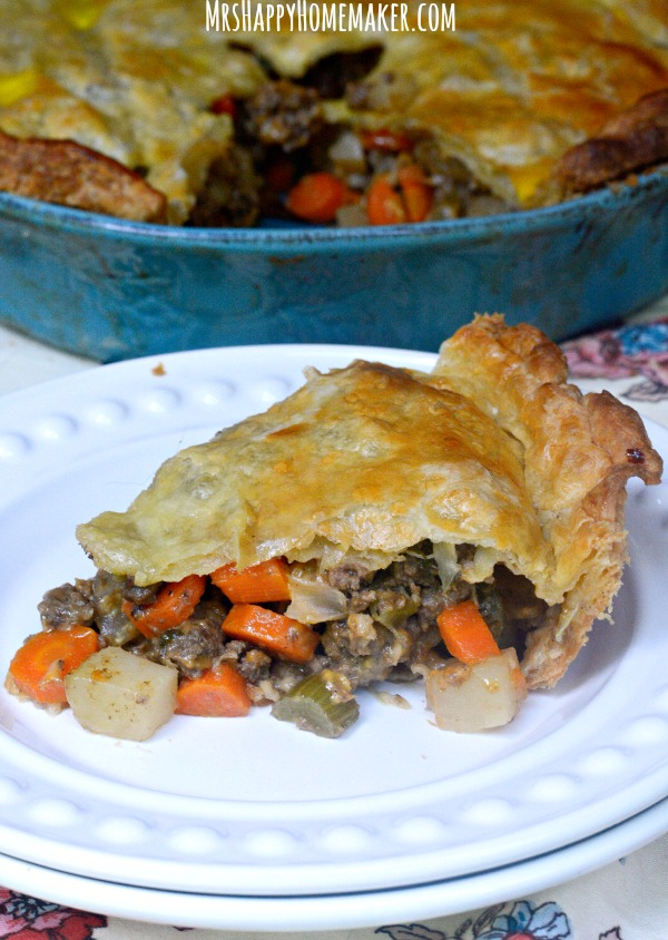 This Beef Puff Pie recipe has been a family favorite for many years now. Beef & veggies simmered in a secret ingredient then encased in a puff pastry crust. ABSOLUTELY DELICIOUS!! | MrsHappyHomemaker.com @thathousewife
