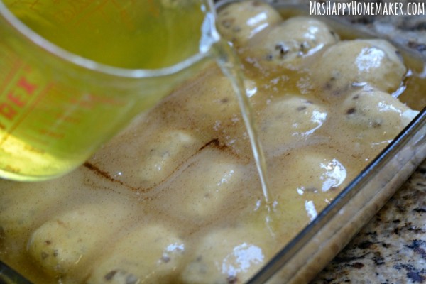 Mountain Dew being poured over Cinnamon Roll Apple Dumplings - as in these delicious apple dumplings are encased with cinnamon rolls!|  MrsHappyHomemaker.com 
