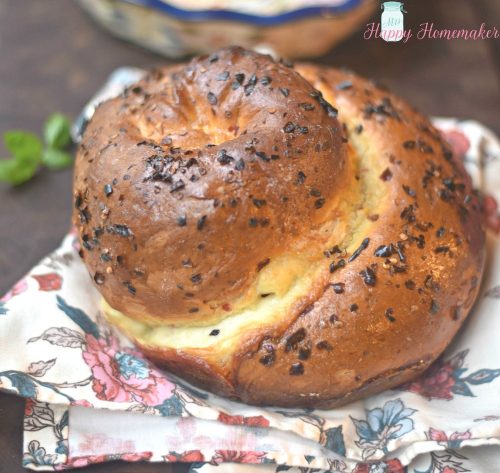 Spicy Cheese Bread - speckled with red pepper flakes, stuffed with 2 kinds of cheese, rolled into a giant swirl, & baked to perfection
