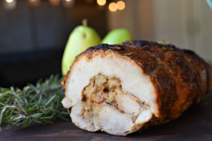 Pork loin butterflied & then rolled with a sourdough stuffing complete with fresh pears, crispy bacon, & savory garlic & onion - Stuffed Pork Roast with Pears, Bacon, & Onions
