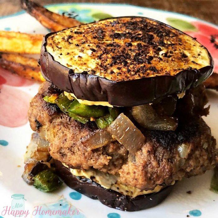 This SPICY JALAPENO BURGER with a garlic crusted eggplant bun has been the recipe to get me through my burger cravings during my Whole30 reset… and to be completely honest, I don’t even miss the bun at all. Since their is no bun, obviously it’s low carb, gluten & grain free. It’s SO good. Like really, truly GOOD. Perfect for anyone trying to eat healthier (or doing paleo, keto, etc) while not wanting to sacrifice flavor. | MrsHappyHomemaker.com