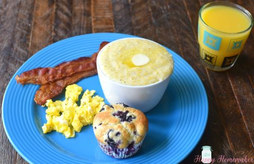 SOUTHERN STYLE CREAMY GRITS on a blue plate with bacon and muffin and juice | MrsHappyHomemaker.com