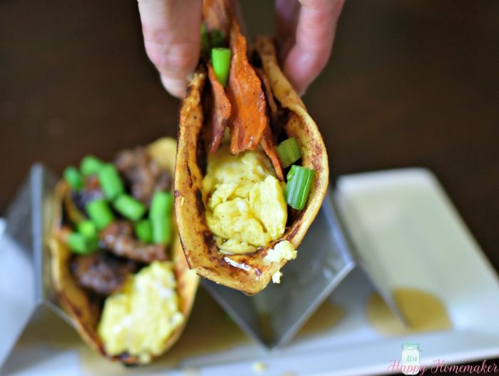 French Toast Tacos - flour tortillas dipped in French toast batter and cooked then stuffed with sausage or bacon and eggs with green onion garnish and a drizzle of pancake syrup 