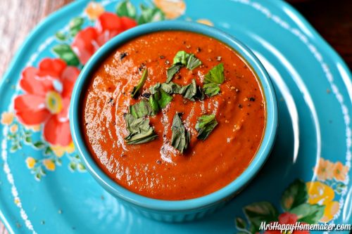 Roasted Tomato Soup with parsley garnish in a blue bowl
