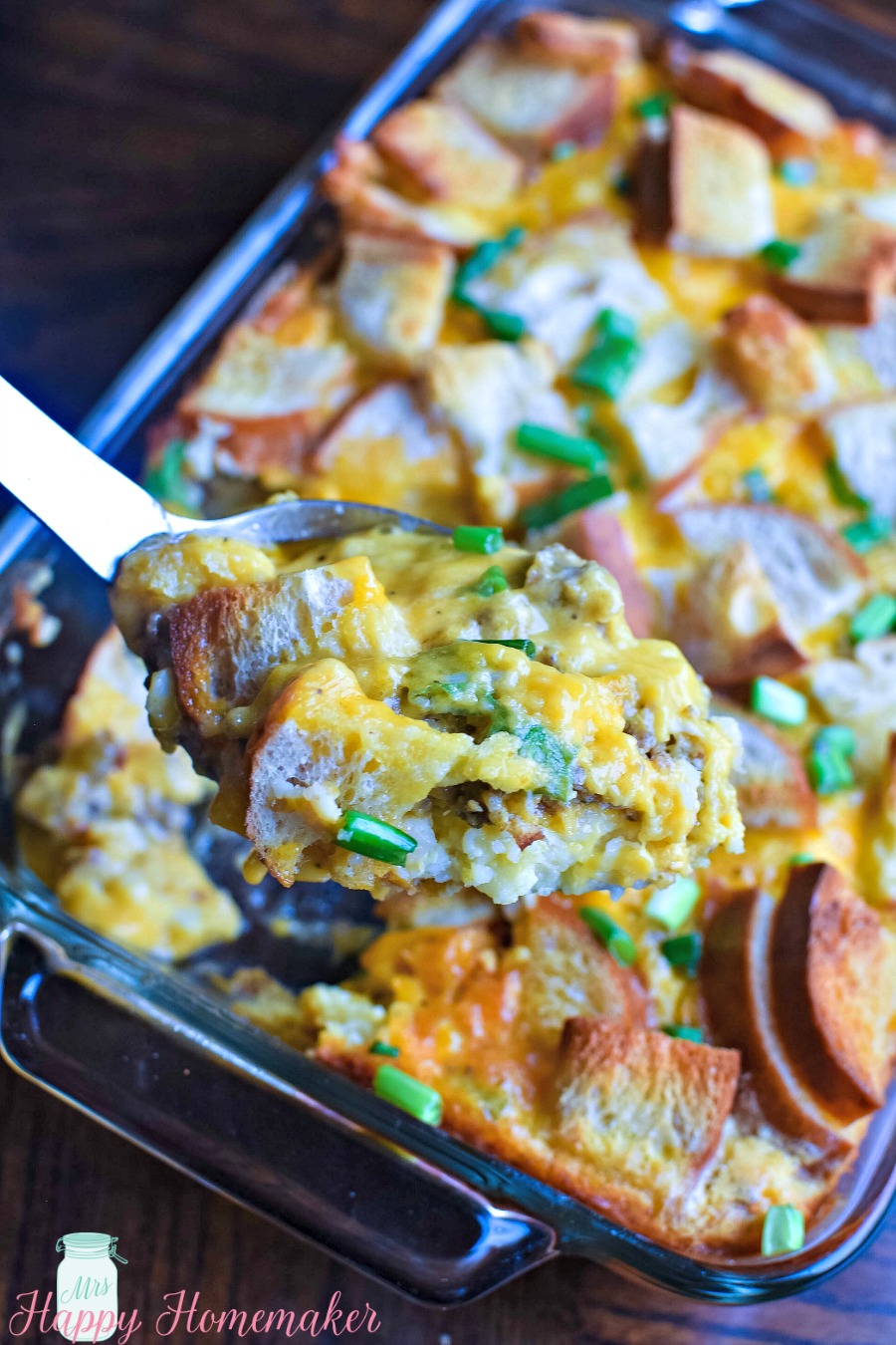 This Country Breakfast Casserole has eggs, cheese, buttered toast, sausage, & gravy with a hash brown crust.