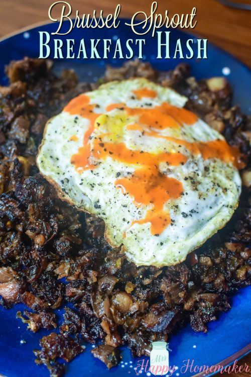 Brussel Sprout Breakfast Hash with a fried egg and drizzle of hot sauce