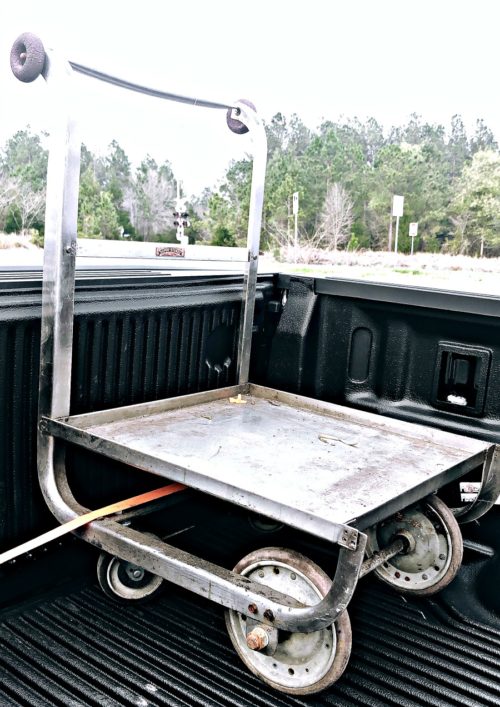 unique cart strapped inside a truck bed