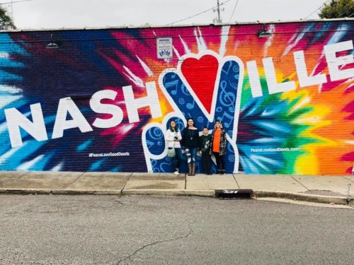 mrs happy homemaker and her kids in Nashville infront of a mural