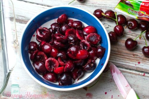 pitted cherries in a blue bowl