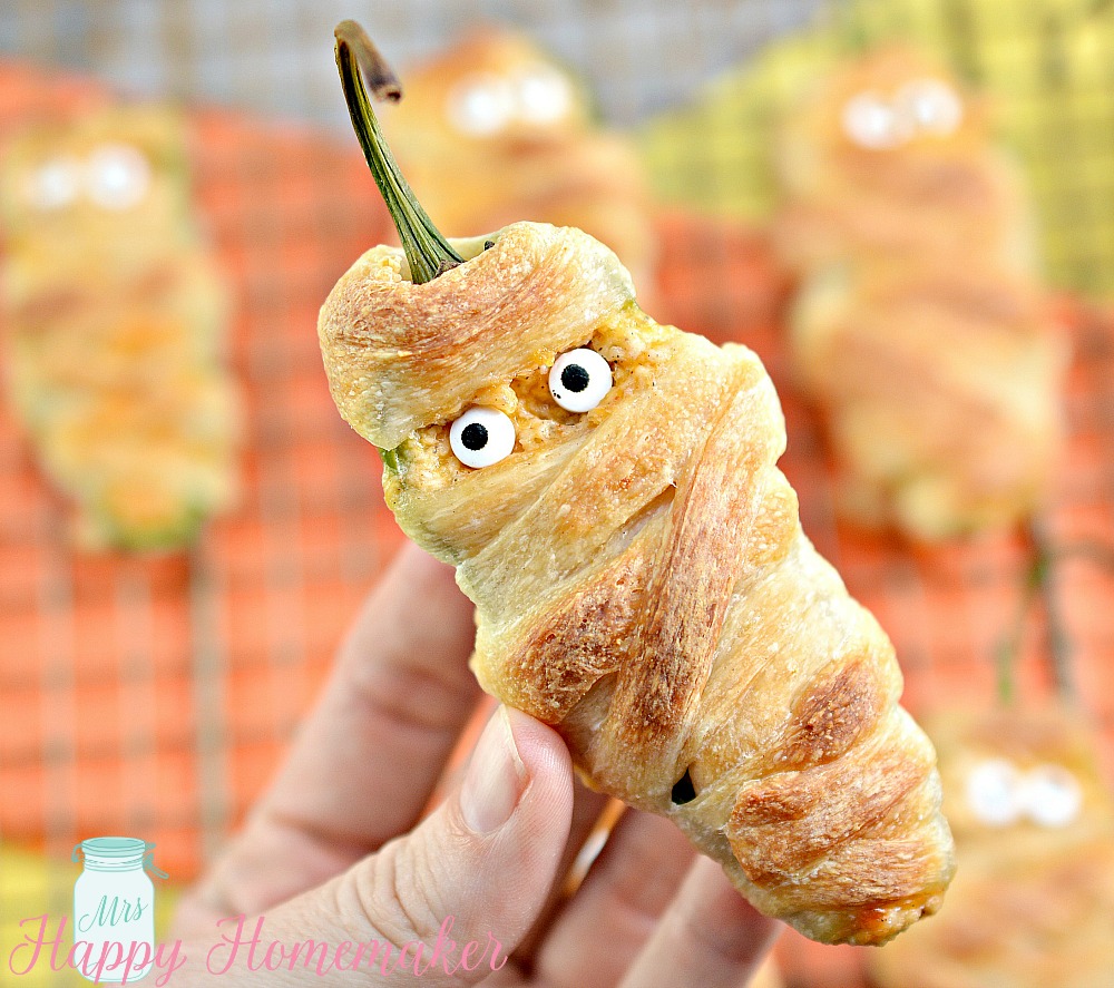 Jalapeno Popper Mummies - jalapeños stuffed with cheese and wrapped in refrigerated dough strips to resemble mummy wrappings. 