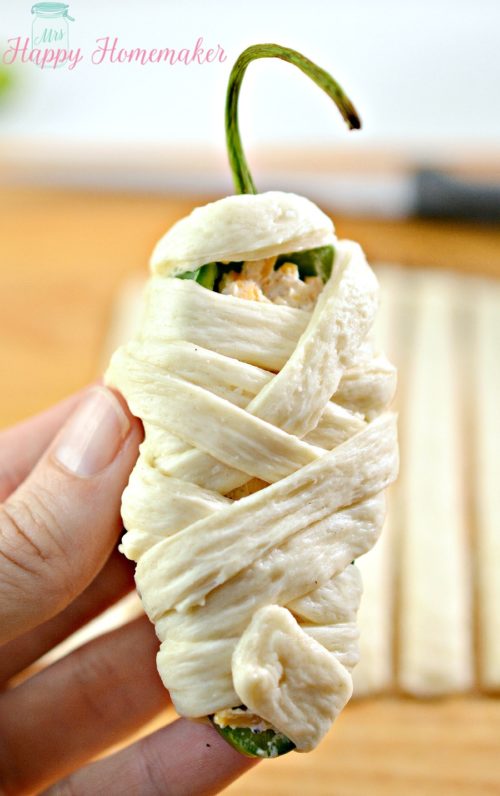 Jalapeno Popper Mummies - jalapeños stuffed with cheese and wrapped in refrigerated dough strips to resemble mummy wrappings.