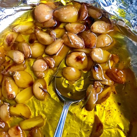Homemade Garlic Confit with a spoon