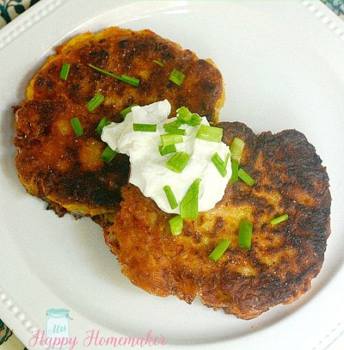 zucchini fritters topped with sour cream and green onions