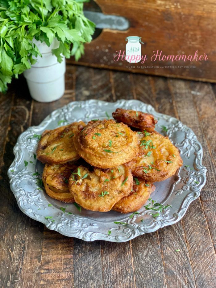 Beer battered fried green tomatoes on a silver plate