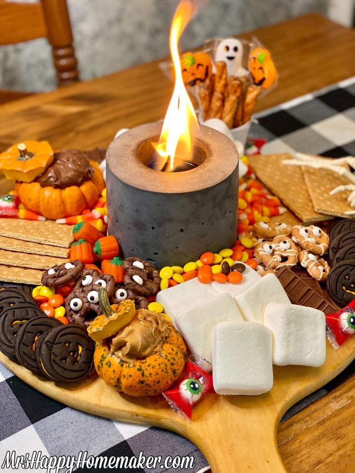 Halloween s’mores board with an indoor firepit in the middle