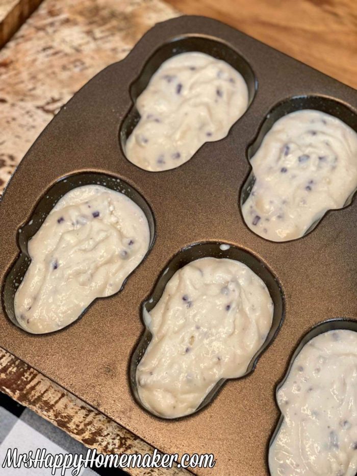 Muffin batter inside of a skull shaped pan