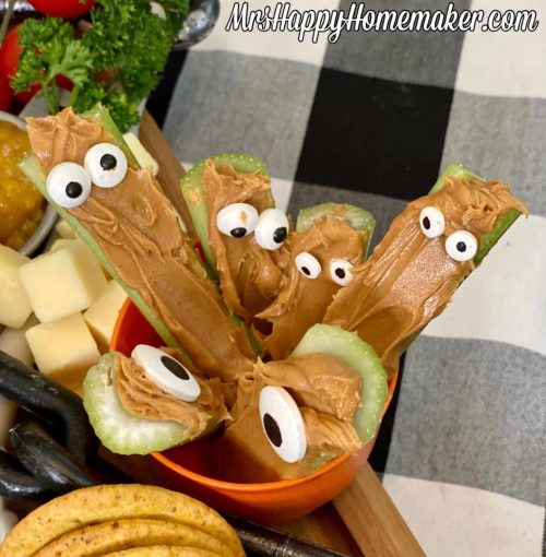Halloween celery monsters - peanut butter filled celery with candy eyeballs