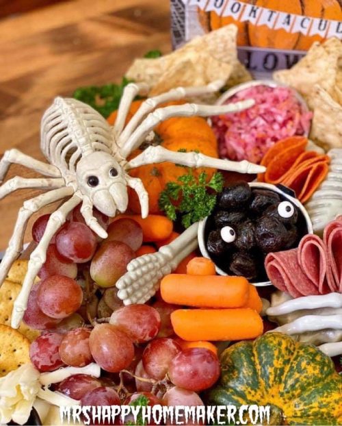 Plastic spider on a halloween charcuterie board
