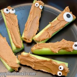 Peanut butter stuffed celery with candy eyeballs
