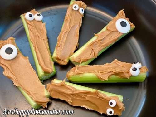 Peanut butter stuffed celery with candy eyeballs