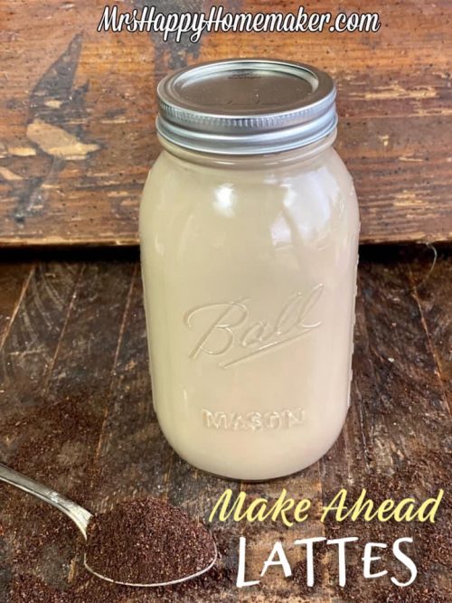 make ahead lattes in a mason jar with a spoon of ground coffee beside of it