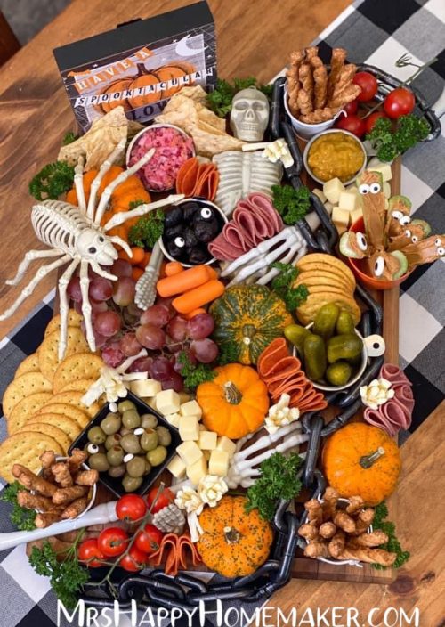 Halloween Charcuterie Board with a skeleton in the middle