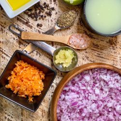 Ingredients for the habanero red onion salsa spread out on a table