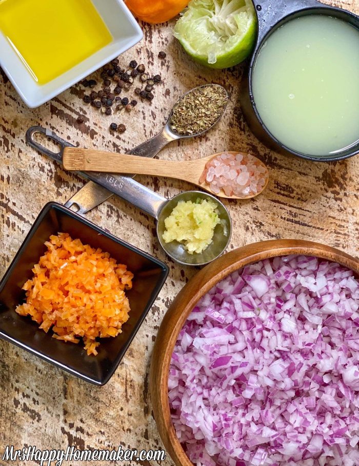 Ingredients for the habanero red onion salsa spread out on a table