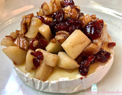 Baked brie with apples, cranberries and pecans