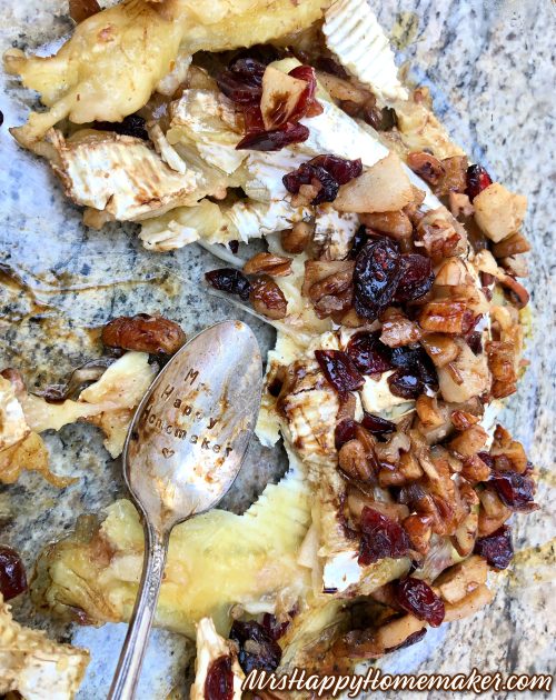 apple pecan baked Brie in a clear dish