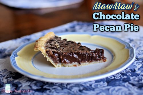 chocolate pecan pie slice on a yellow rimmed plate