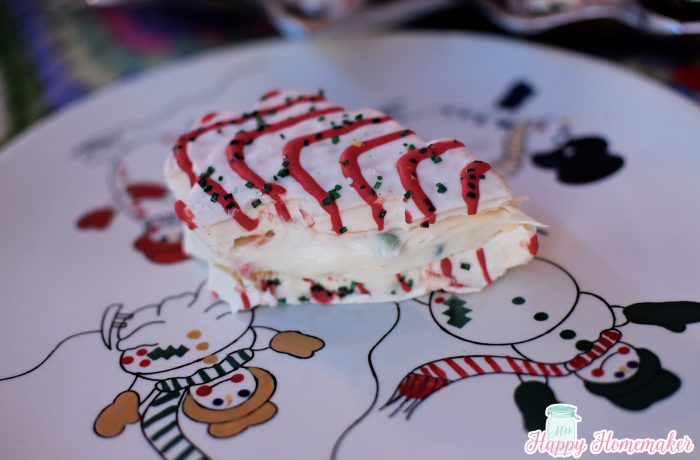 Christmas Tree Cakes stuffed with frosting on a snowman plate