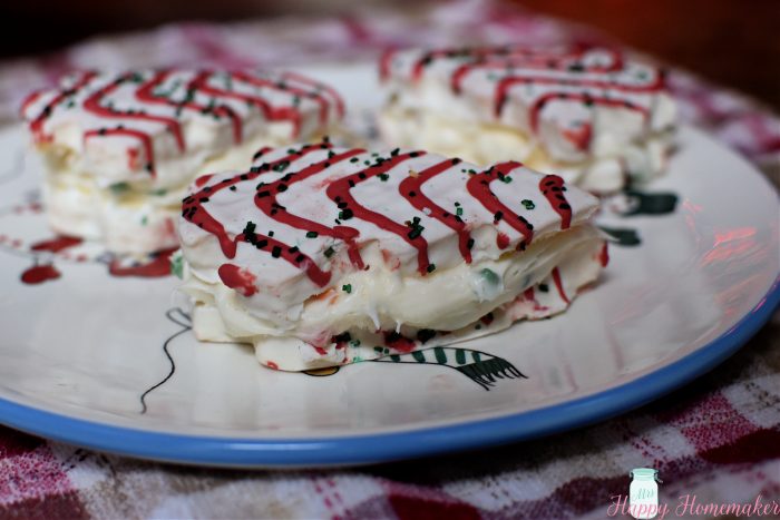 christmas tree cake sandwiches on a snowman plate