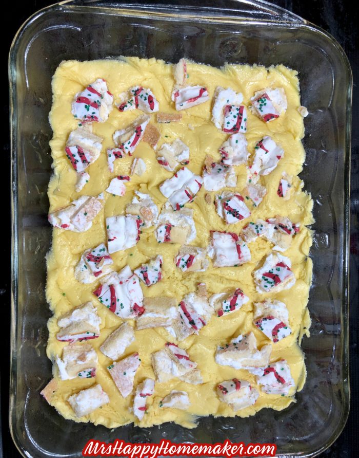 gooey butter cake batter with chopped up little debbie Christmas tree cakes in it