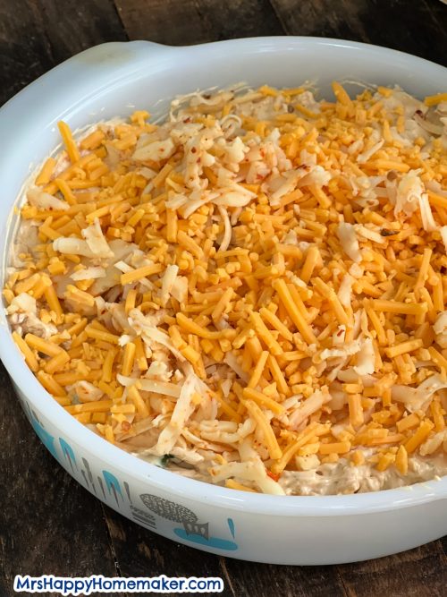 Baked shrimp dip, uncooked, in a round white baking dish