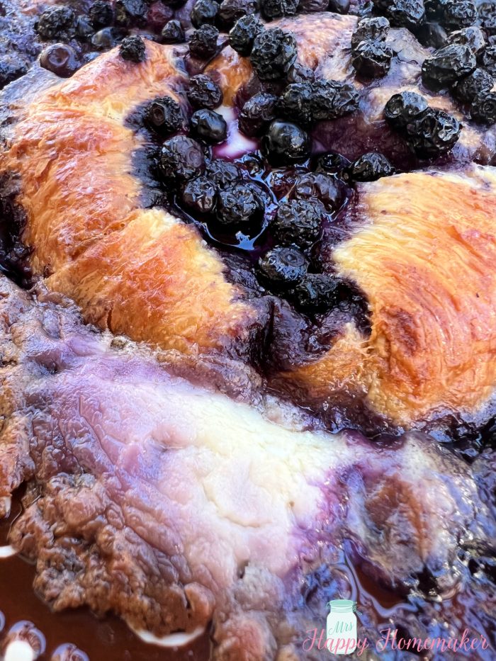 Blueberries and cream croissant French toast bake in a casserole dish with a brown rim