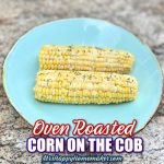 Two corn on the cobs on a blue plate on granite countertop