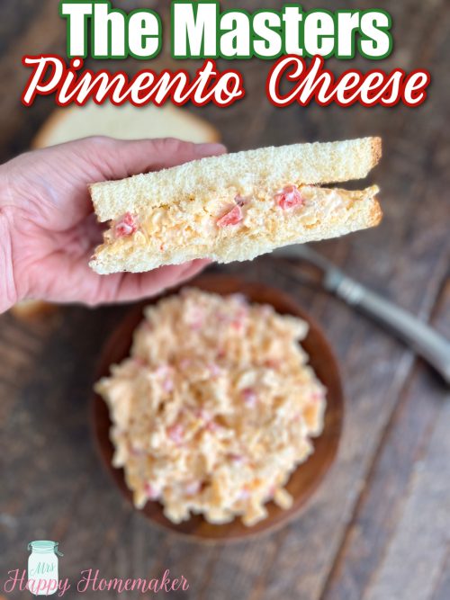 the Masters’ pimento cheese - some in a brown bowl and some spread inside of a sandwich being held by a hand