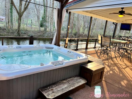 Hot tub on a back deck overlooking the river